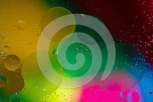 Gold and green paint bubbles and oil drops. abstract background