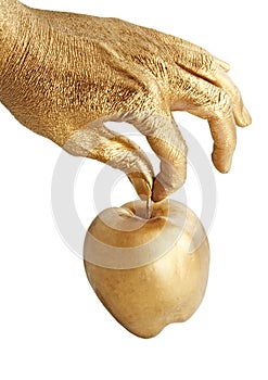 Gold hand holding apple