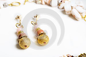 Gold handmade earrings with pink semipreciouses. nephritis and v