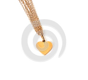 Gold heart on chain, isolated on white