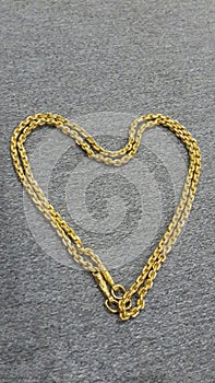 Gold heart on cotton.