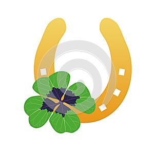 Gold horseshoe with four leaf clover. Lucky symbols. photo