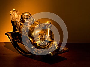 Gold Hotei seating in the rocking-chair photo