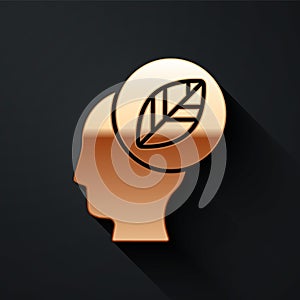 Gold Human head with leaf inside icon isolated on black background. Long shadow style. Vector.