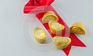 Gold ingot Red ribbon bow on white background.