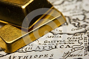 Gold-ingots and a map of Africa