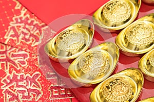 Gold ingots on red envelope of China in the Chinese New Year