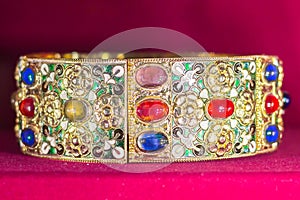 Gold and jewell-studded King`s crown close-up in the gallery