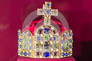 Gold and jewell-studded King`s crown close-up in the gallery