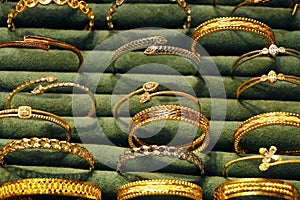 Gold jewelry diamond shop with rings and necklaces luxury retail store window display showcase