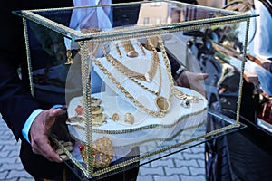 Gold jewelry in the glass box for Muslim bride