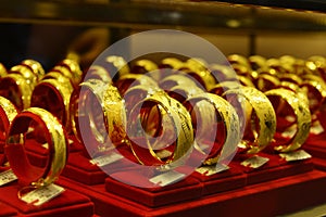 Gold jewelry in gold shop showcase,Shop window with a lot of jewellery