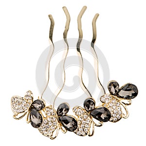 Gold jewelry for hair on a white background with shining gems, crystals.