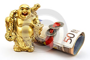 Gold laughing Buddha with money and chinese coins