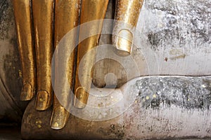 Gold leaf buddhas fingers sukhothai thailand photo