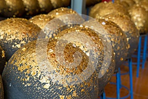 Gold leaf sheet on marker spheres in the temple compound, focus selective