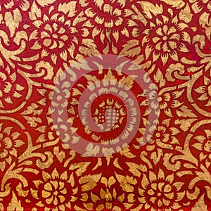 The gold leaf on wood for the background and textures. Thai style pattern on red wall