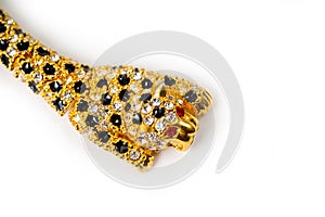 Gold leopard bracelet with shiny pebbles, lepard eyes made of bright red stones