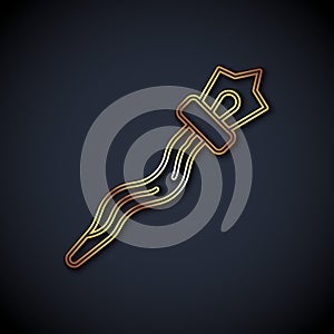 Gold line Magic staff icon isolated on black background. Magic wand, scepter, stick, rod. Vector