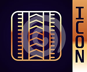 Gold line Tire track icon isolated on black background. Vector