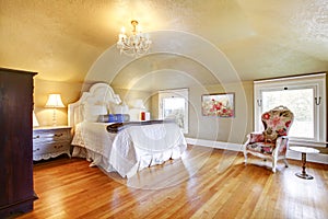 Gold luxury bedroom with white bedding.