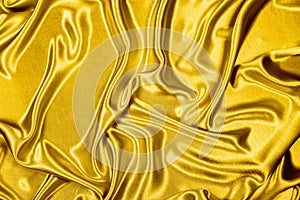 Gold luxury satin fabric texture for background and art design