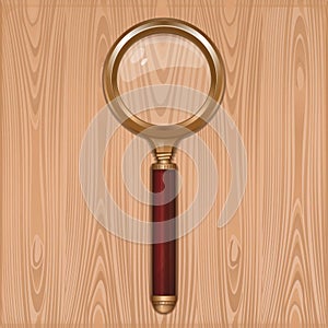 Gold magnifier with red handle. Reading glass