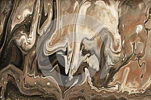 Gold marbling texture design. Beige and golden marble pattern. Fluid art.