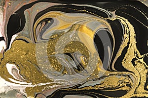 Gold marbling texture design. Beige and golden marble pattern. Fluid art.