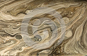 Gold marbling texture design. Beige and golden marble pattern. Fluid art.