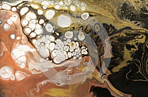 Gold marbling texture design. Beige and golden marble pattern. Fluid art.