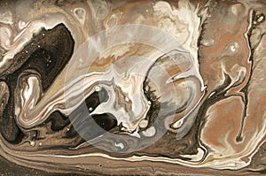 Gold marbling texture design. Beige and golden marble pattern. Fluid art.