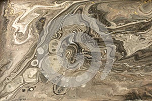 Gold marbling texture design. Beige and golden marble pattern. Fluid art.