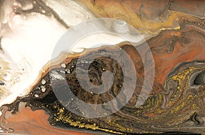 Gold marbling texture design. Beige and golden marble pattern. Fluid art.