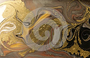 Gold marbling texture design. Beige and golden marble pattern. Fluid art.