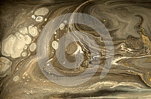 Gold marbling texture design. Beige and golden marble pattern. Fluid art.