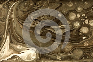 Gold marbling texture design. Beige and golden marble pattern. Fluid art.