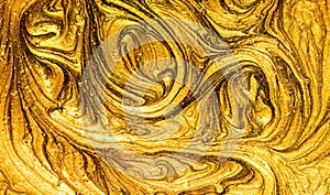 Gold marbling texture design. Beige and golden marble pattern. Fluid art. Effect, glitter.