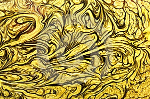 Gold marbling texture design. Beige and golden marble pattern. Fluid art. Effect, glitter.