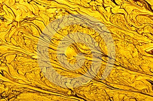Gold marbling texture design. Beige and golden marble pattern. Fluid art. Effect, glitter.