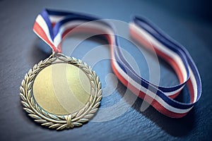 Gold medal award trophy on ribbon background