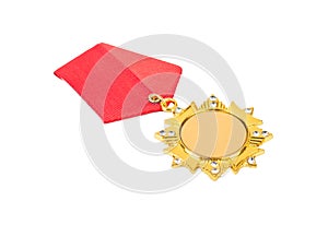Gold medal in the shape of a star with a red ribbon