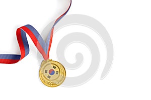 Gold medal on white background as a symbol of victory in sports competition in South Korea