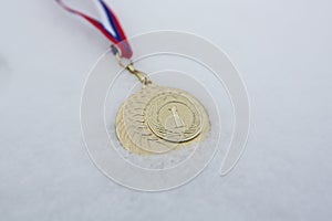 Gold medal in white backgrounds for winners in winter games