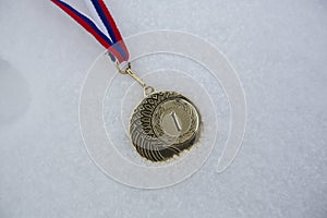 Gold medal in white backgrounds for winners in winter games