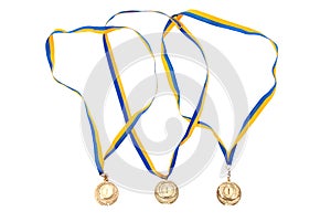 Gold medals isolated on white