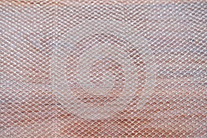 gold mesh on wooden background