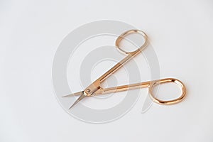 Gold metal closed and open scissors set on white background isolated closeup, steel cutting tool for manicure