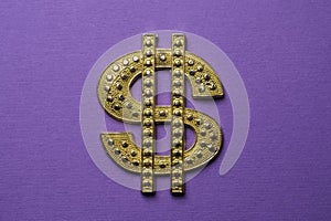 A gold metal dollar sign