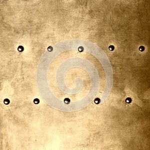 Gold metal plate or armour texture with rivets